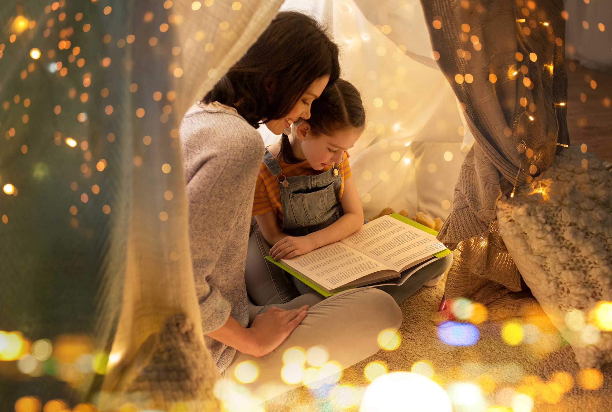 mother and child reading a book together